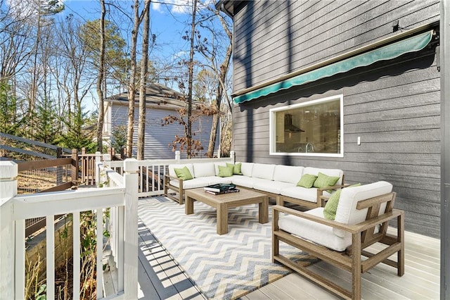 wooden terrace with an outdoor hangout area