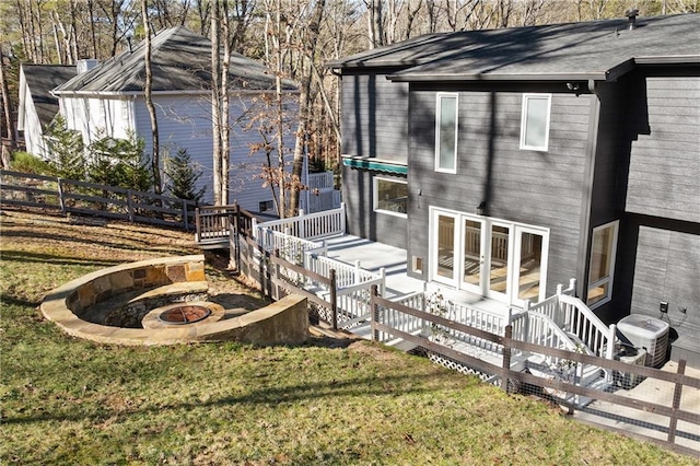 exterior space with a yard and a fire pit