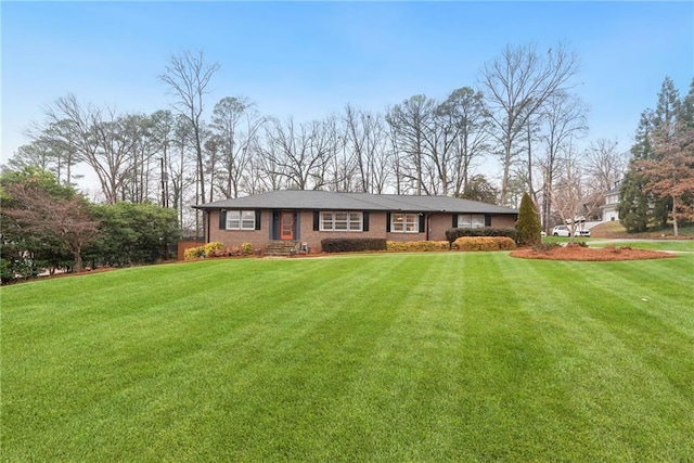 ranch-style home with a front yard