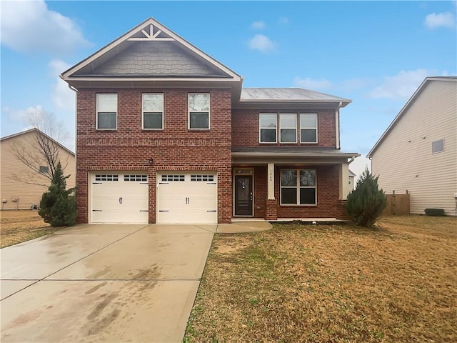 craftsman inspired home featuring an attached garage, a front yard, concrete driveway, and brick siding