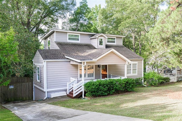 view of front facade with a front lawn and a porch