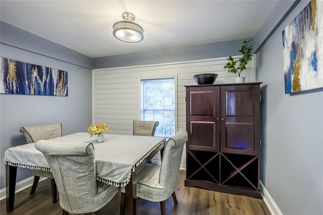 dining area with dark wood-type flooring