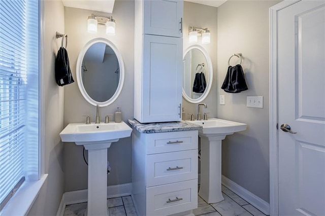 bathroom featuring double sink