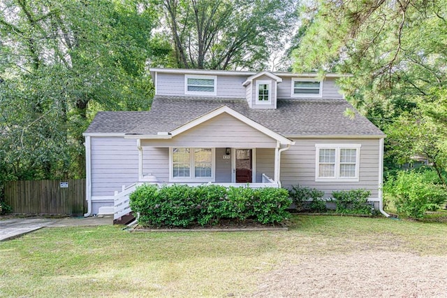 view of front of property with a front yard and a porch