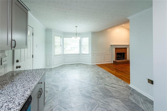 interior space featuring ornamental molding and an inviting chandelier