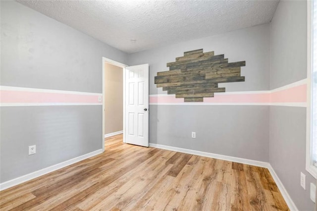 5375 Mountain View Pkwy, Lula, GA 30554 - empty room with wood finished floors, a textured ceiling, and stairway
