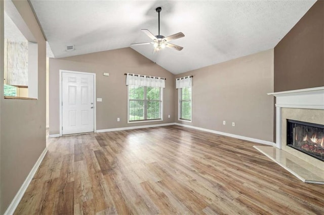 5375 Mountain View Pkwy, Lula, GA 30554 - unfurnished living room with a ceiling fan, wood finished floors, a high end fireplace, and lofted ceiling