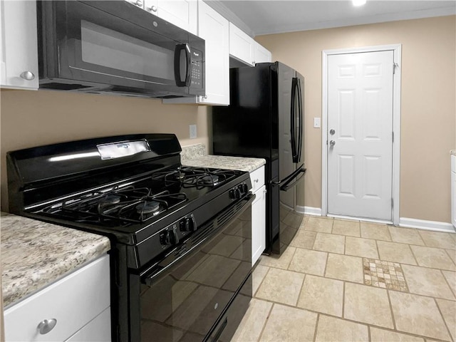 kitchen with black appliances, white cabinets, and light stone counters