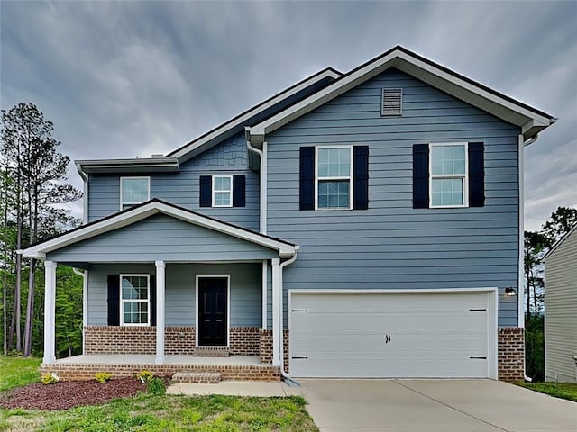 view of front of property featuring a garage and covered porch