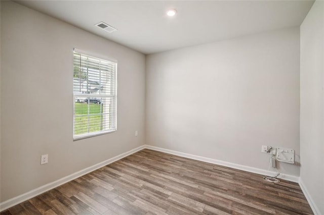 spare room featuring hardwood / wood-style flooring