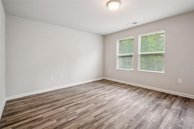 empty room featuring wood-type flooring