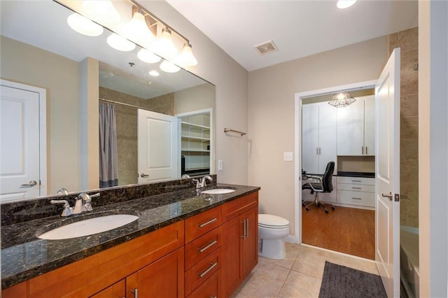 bathroom featuring tile patterned flooring, visible vents, a sink, and toilet