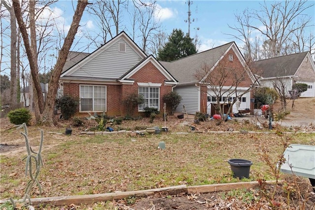 single story home with brick siding