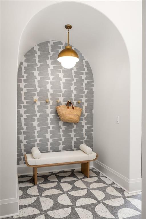 bedroom with wood-type flooring and a notable chandelier