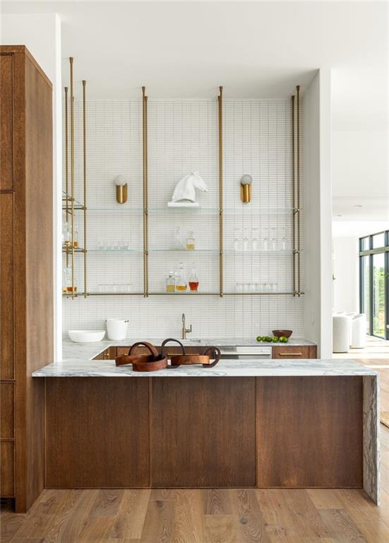 kitchen with decorative backsplash and high end stove