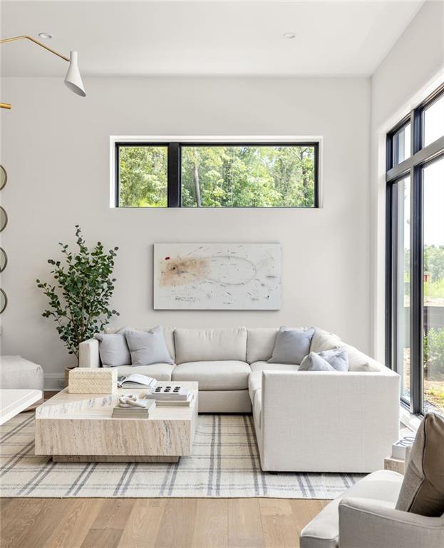 living room featuring hardwood / wood-style floors and a notable chandelier