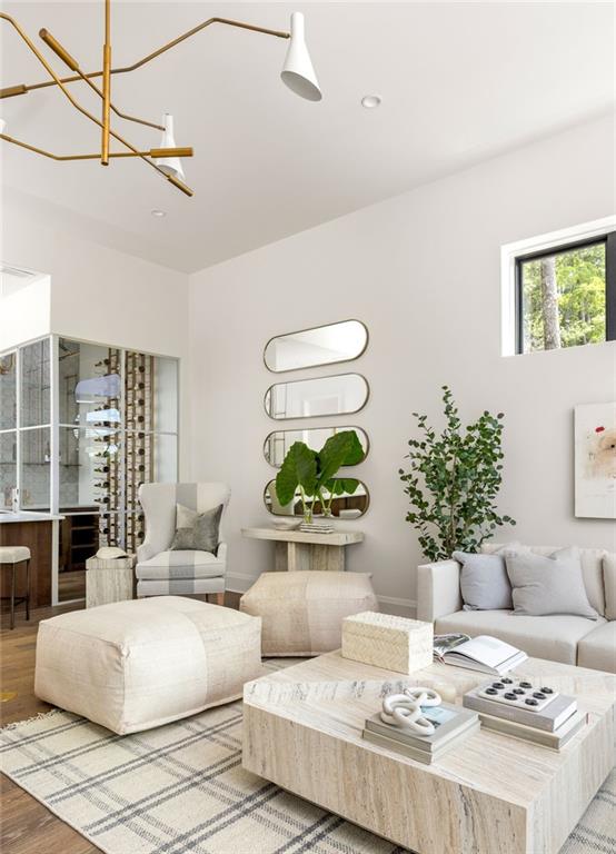 interior space with hardwood / wood-style floors and an inviting chandelier