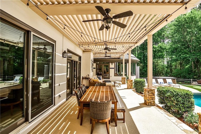 view of patio / terrace featuring outdoor dining area, an outdoor pool, and ceiling fan