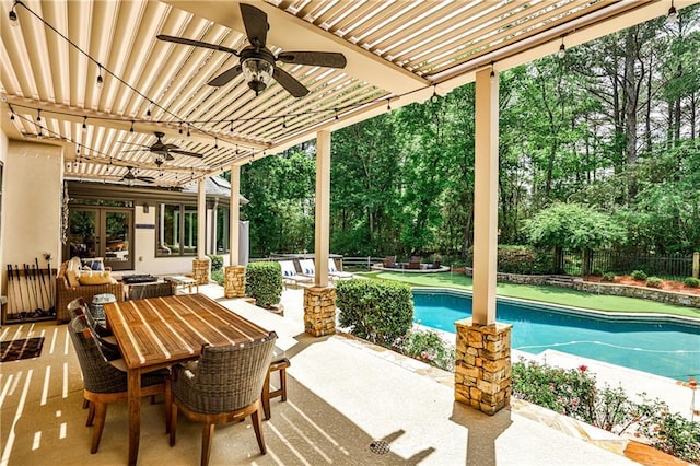 view of patio with fence private yard, french doors, a fenced in pool, a ceiling fan, and outdoor dining space