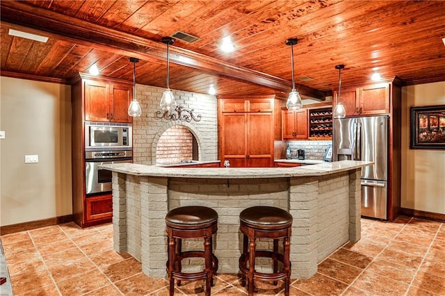 kitchen with baseboards, ornamental molding, wooden ceiling, and stainless steel appliances