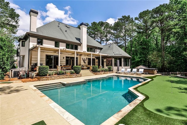 pool with fence and a patio