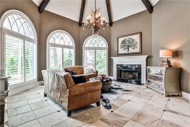 living area featuring high vaulted ceiling, baseboards, beam ceiling, and a notable chandelier