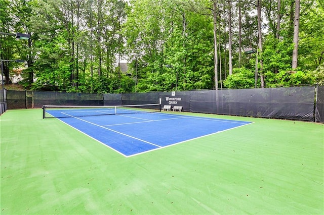 view of sport court with community basketball court and fence