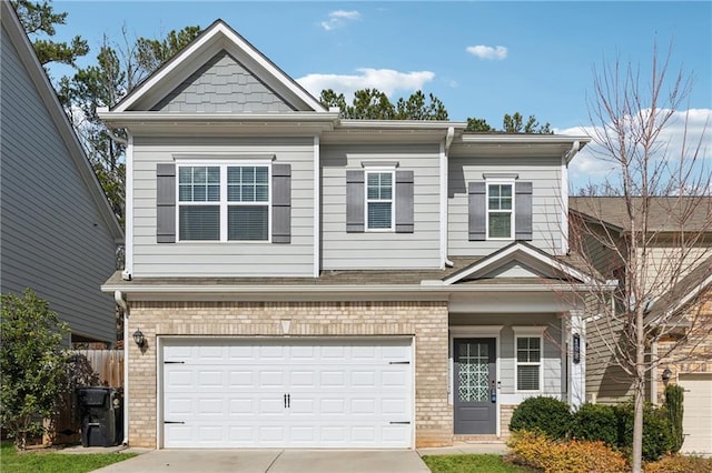 view of front of property with brick siding, driveway, an attached garage, and fence