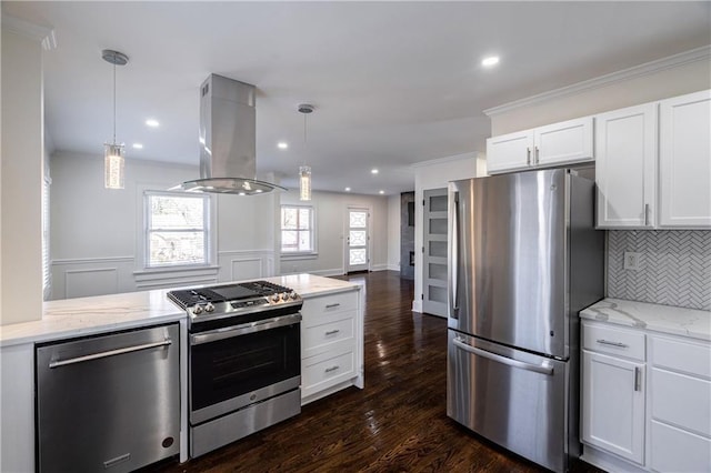 kitchen with tasteful backsplash, appliances with stainless steel finishes, island exhaust hood, and light stone counters