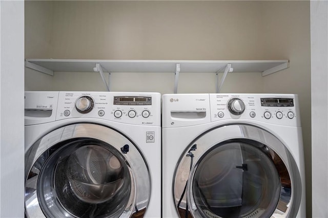 washroom with mail area, washing machine and dryer, and laundry area