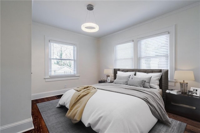 bedroom with baseboards, dark wood-style flooring, and ornamental molding