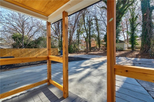 deck with a patio and fence