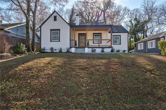 bungalow-style house with a front lawn, a porch, and a chimney