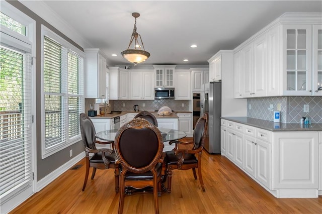 5810 Old Mill Trce, Lithonia, GA 30038 - kitchen with appliances with stainless steel finishes, white cabinets, light wood finished floors, decorative backsplash, and recessed lighting