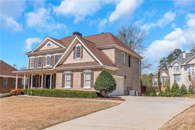 5810 Old Mill Trce, Lithonia, GA 30038 - view of front of house with driveway, covered porch, a garage, and brick siding