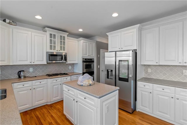 5810 Old Mill Trce, Lithonia, GA 30038 - kitchen with stainless steel appliances, white cabinets, light wood finished floors, light countertops, and recessed lighting