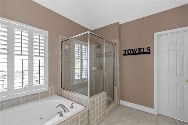 5810 Old Mill Trce, Lithonia, GA 30038 - bathroom with a tub with jets, a shower stall, tile patterned flooring, and baseboards