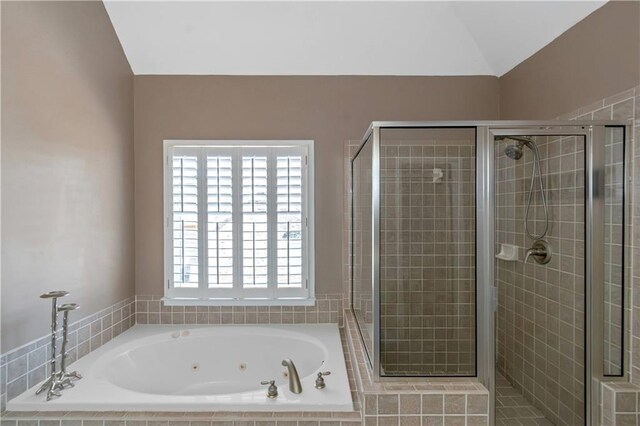 5810 Old Mill Trce, Lithonia, GA 30038 - full bathroom with a whirlpool tub, a stall shower, and vaulted ceiling