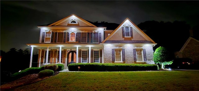 5810 Old Mill Trce, Lithonia, GA 30038 - view of front facade featuring a lawn, a porch, and stucco siding