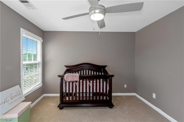5810 Old Mill Trce, Lithonia, GA 30038 - carpeted bedroom featuring baseboards, ceiling fan, and a crib