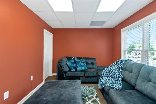 5810 Old Mill Trce, Lithonia, GA 30038 - living area with a paneled ceiling, carpet, and baseboards