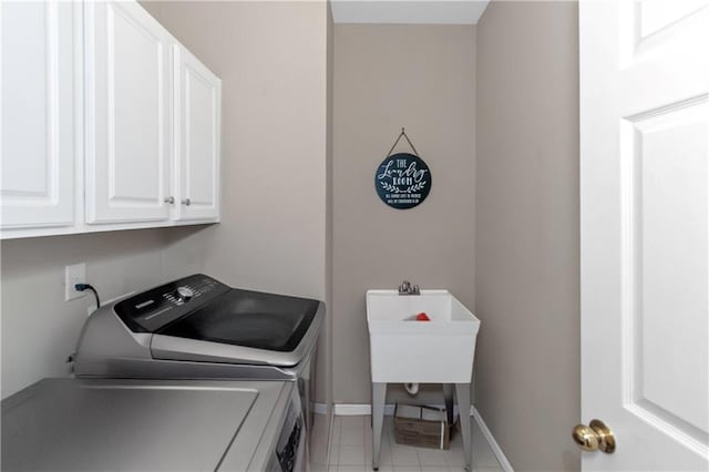 5810 Old Mill Trce, Lithonia, GA 30038 - laundry room with cabinet space, separate washer and dryer, baseboards, and light tile patterned flooring