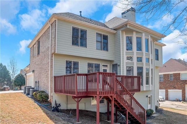 5810 Old Mill Trce, Lithonia, GA 30038 - rear view of property with a chimney, a wooden deck, and stairway