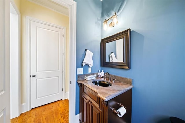 bathroom featuring vanity and hardwood / wood-style floors