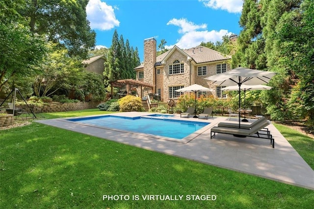 view of swimming pool featuring a patio area, a yard, an in ground hot tub, and a pergola