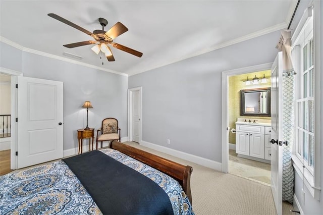 bedroom featuring sink, ceiling fan, light colored carpet, ensuite bathroom, and crown molding