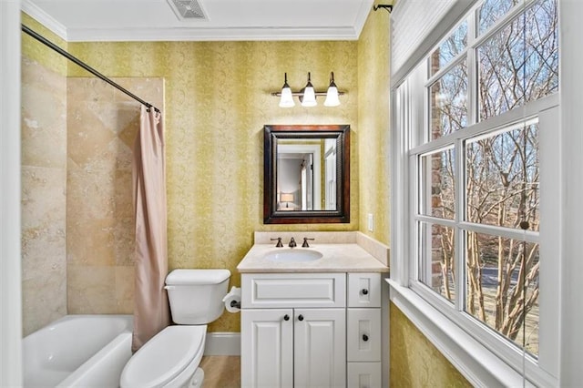 full bathroom with toilet, vanity, crown molding, and shower / bath combo