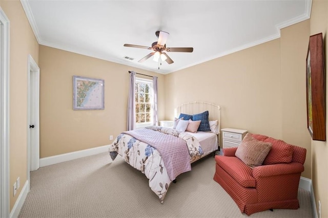 carpeted bedroom with ceiling fan and ornamental molding