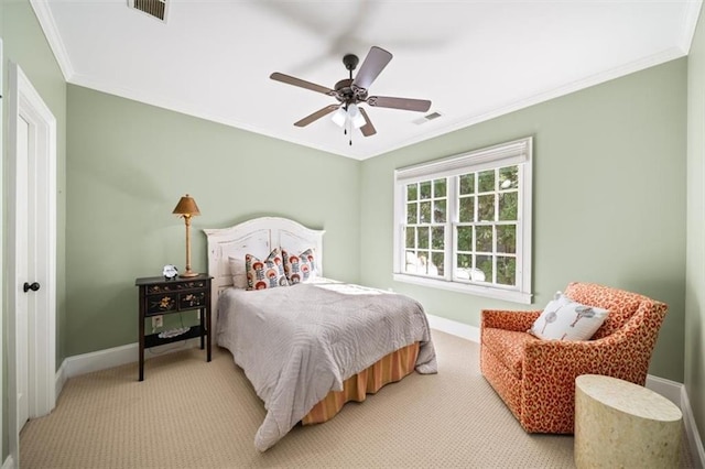 bedroom featuring ceiling fan, ornamental molding, and light carpet