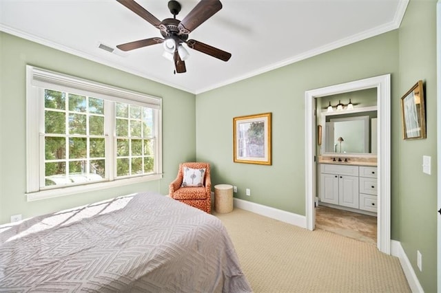 bedroom featuring ceiling fan, light colored carpet, connected bathroom, and ornamental molding